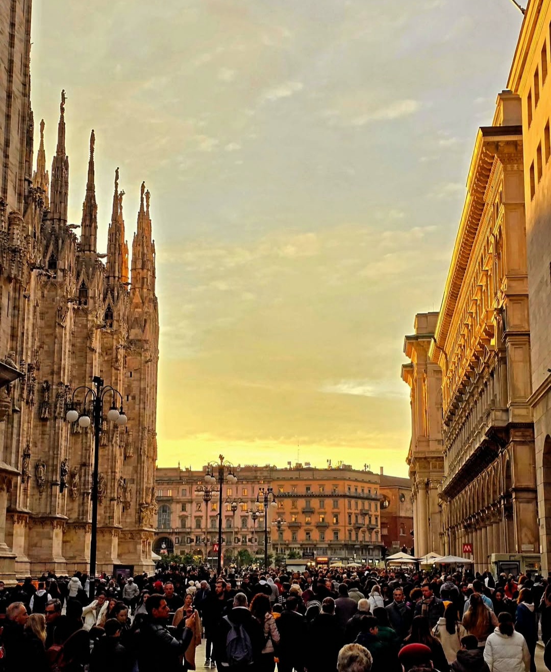 Crowds beside Milan Cathedral at sunset
