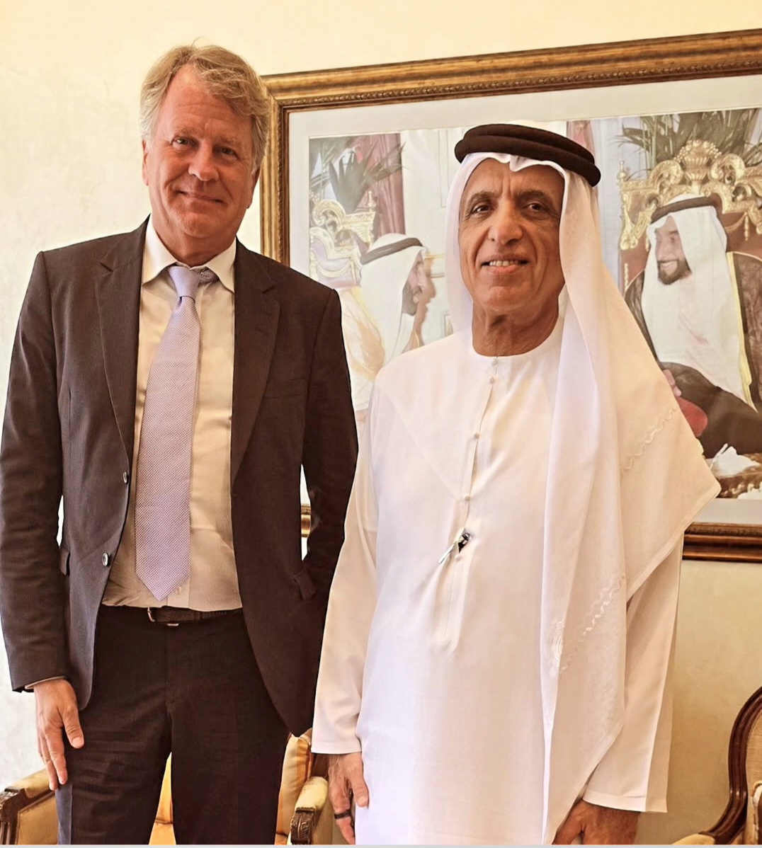 Lars Carlstrom standing with a man in traditional Emirati dress