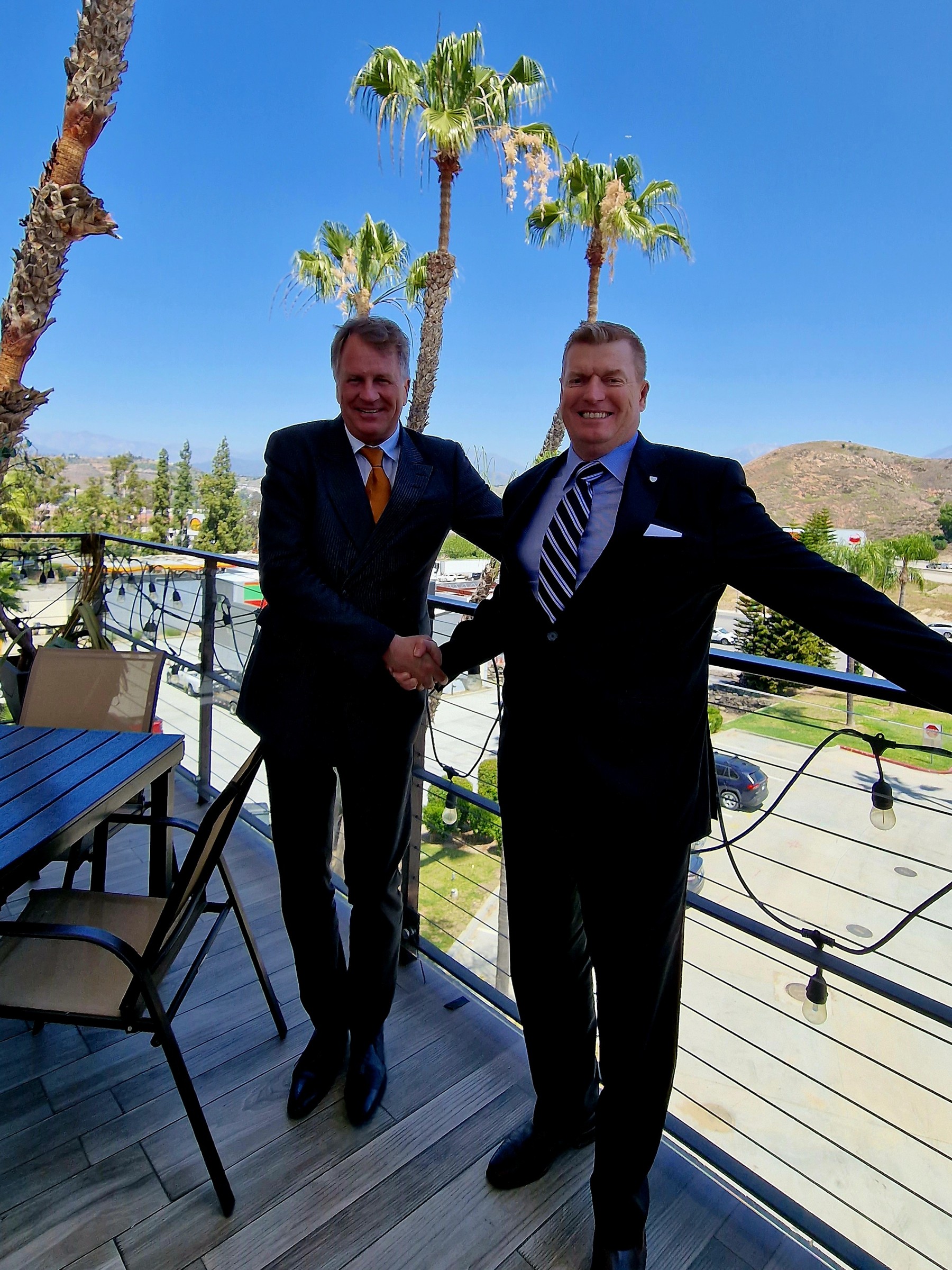 Lars Carlstrom shaking hands on a balcony in Imperial County