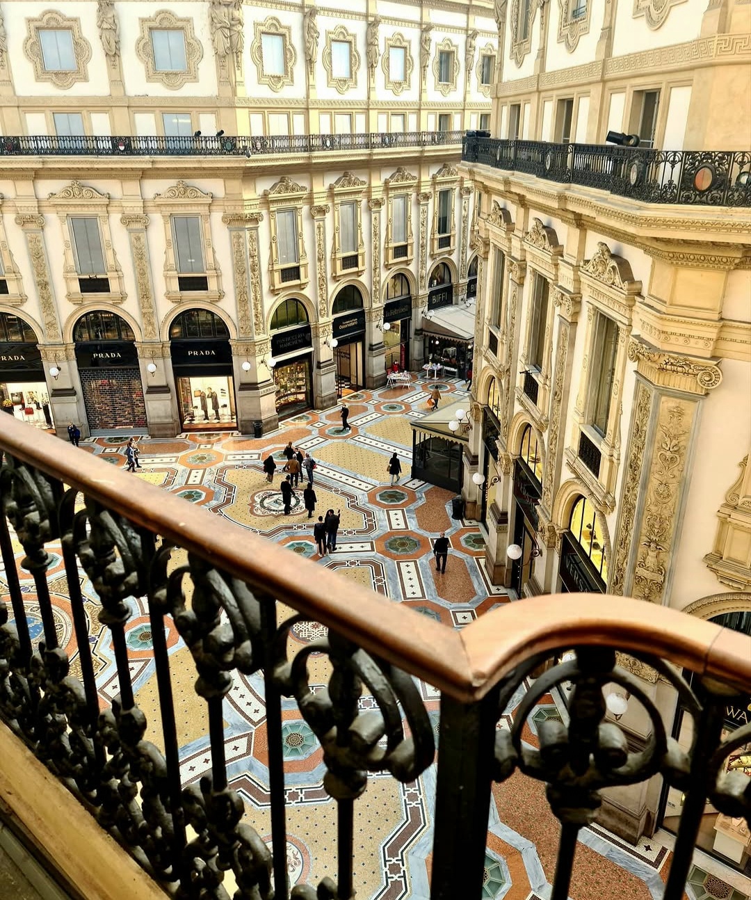 Ornate balconies and mosaic floor inside Milan’s Galleria Vittorio Emanuele II