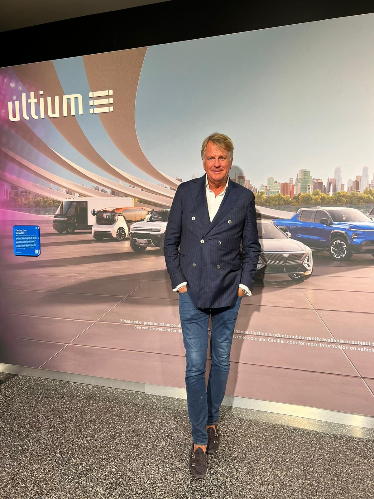 Lars Carlstrom in front of an Ultium vehicle display in Michigan