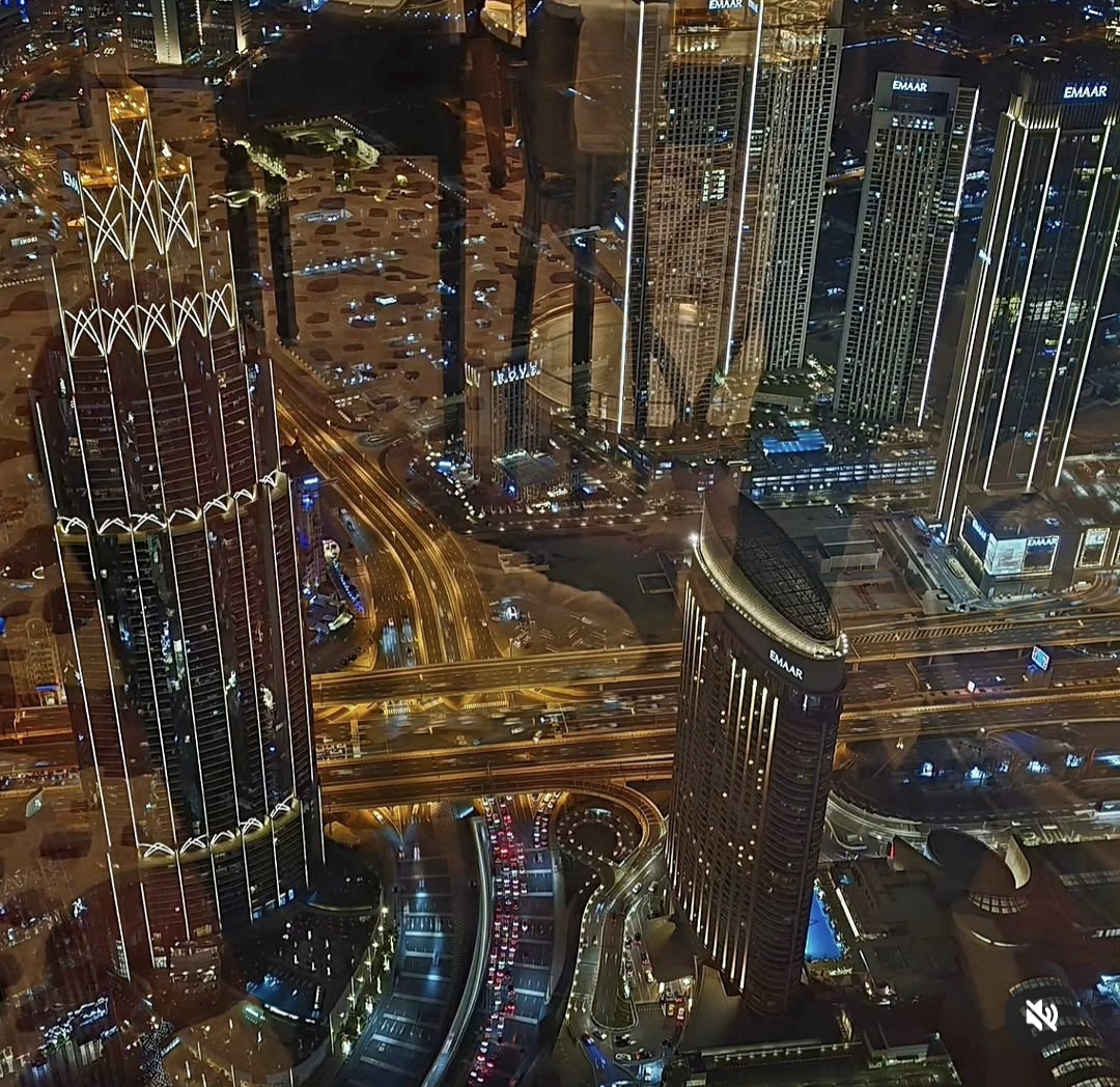 Dubai towers and illuminated roads photographed from above at night